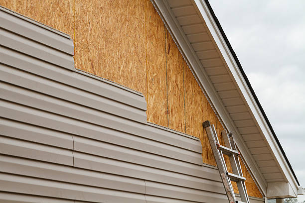 Professional Emergency Siding Repair technician working in Johnstown, NY